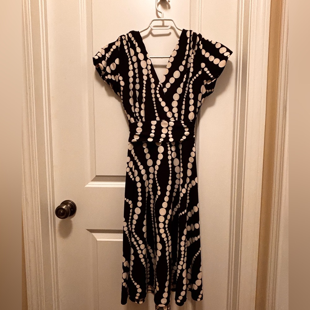 Black and white polka dotted swing style dress
